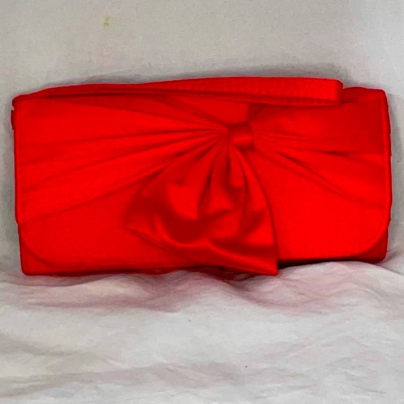 Charming Charlie Handbags - ❤️ Charming Charlie red satin bow clutch/wristlet